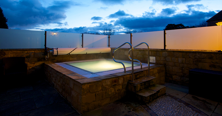 night time at the outdoor hot tub at Headlam Hall hotel